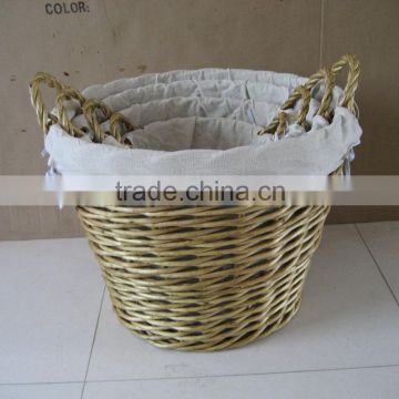 wicker laundry basket with white fabric