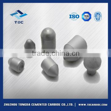 Tungsten carbide buttons for geotechnical drilling tools