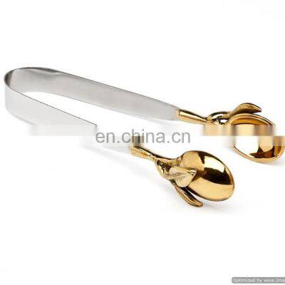 white & gold ice tong