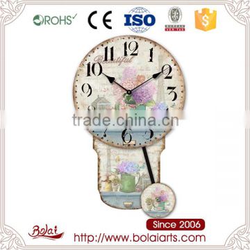 Green cages and bucket flowers design pendulum clock for sale