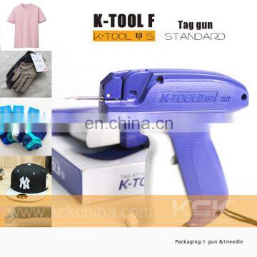 Tag stringing machine for garment