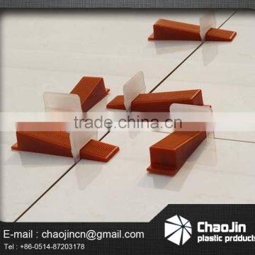 Plastic medium tile leveling system