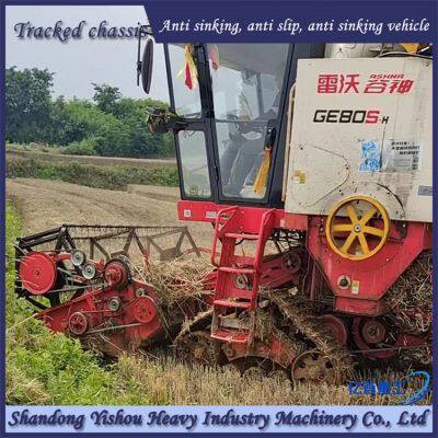 Wheat harvester retrofitted with triangular track wheel mud anti sinking vehicle