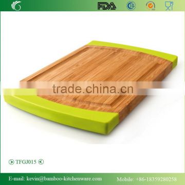 TFGJ015/Promotional goods non slip bamboo cutting board with silicone sides wooden chopping block with yellow non silp silicone