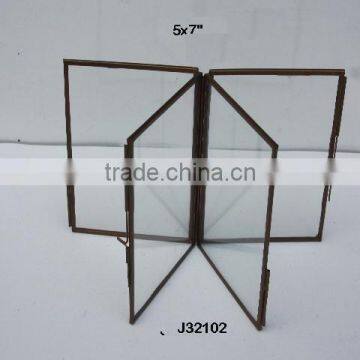 Glass and brass photo frame four panel brass in antique finish available in two sizes