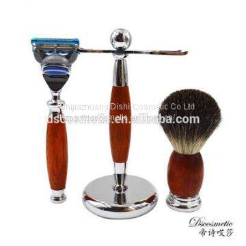 red wooden shaving kit with shaving stand brush and razor