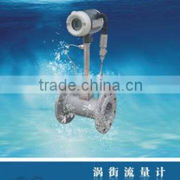 Liquid vortex flow meter with temperature compensation