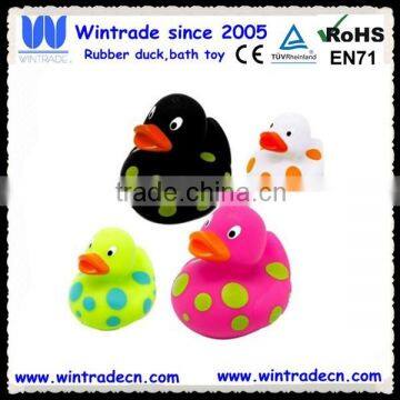 Plastic floating toy duck with dots