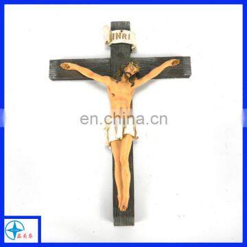 the statue of Jesus and cross for wall decoration