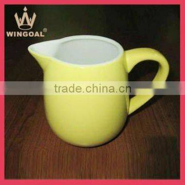 Yellow ceramic milk jug