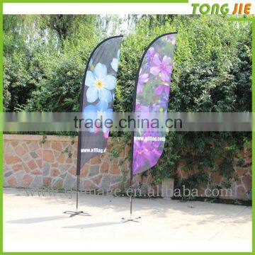 Advertising beach flag, flying flag with spider base
