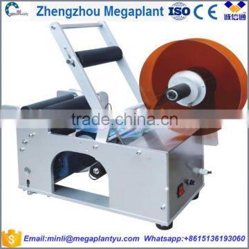 Manual hot melt wet glue water bottles labeling and coding machine