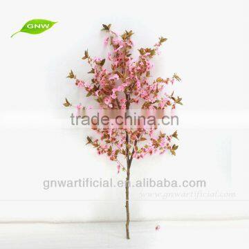 Artificial cherry blossom branch as wedding centerpiece for wedding table decoration