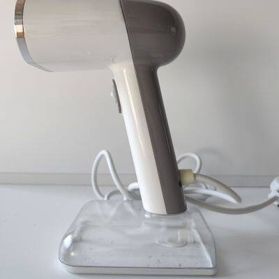 Hand-held garment steamer, low noise, effective ironing of clothes