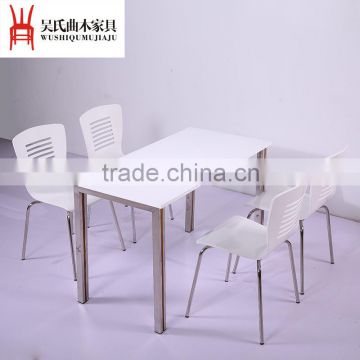 White panel steel bracket dining table