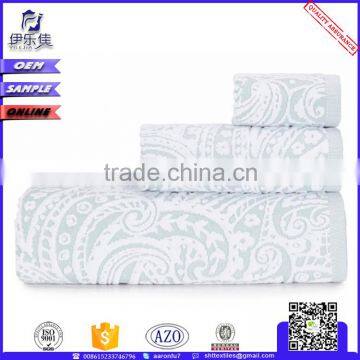 thin luxury brown and white cotton bath towels in compressed bales