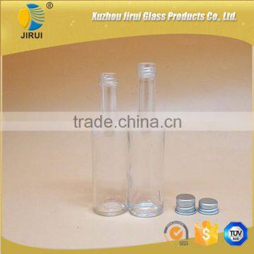 empty transparent liquor glass bottle with metal cap