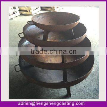 fire bowl and fire pit in metal rusted finish