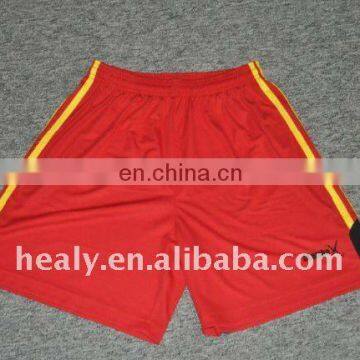 red yellow black football shorts