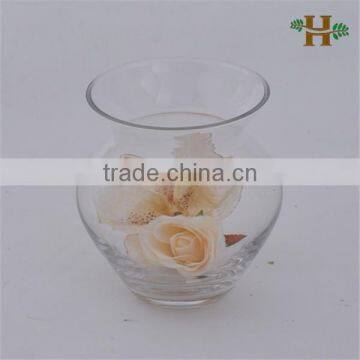 Handmade small clear glass jar with flower arrangement