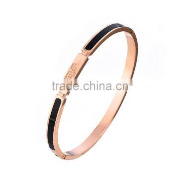 Rose gold plated with black enamel stainless steel bangle with engrave logo