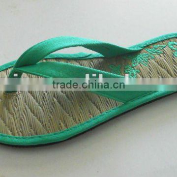 woman embroidery straw beach flip flop