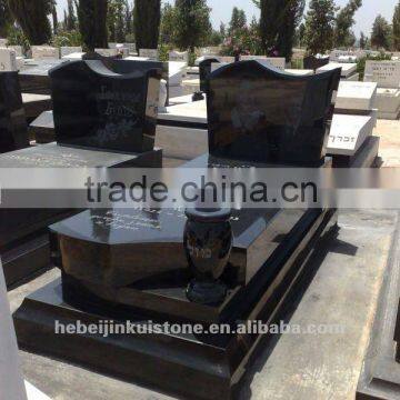 black tombstone and monument