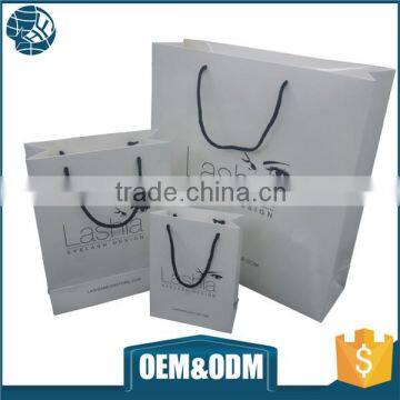 Low cost fashion Custom Paper bags with handle