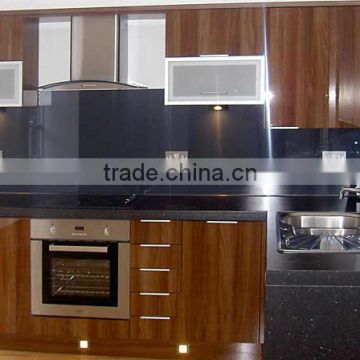 Navy blue kitchen back painted glass backsplash