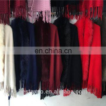 woman winter faux-fur trimmed ponchos with fringe alpaca wool ruana shawl coat