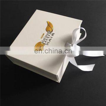 20 x 17.5 x 6.5cm white ribbon box with Logo 4C printing with silver ribbon