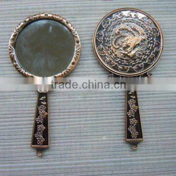 Antique bronze hand mirror