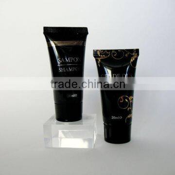 luxury branded first class hotel shampoo tube with gold logo