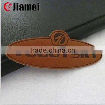 China manufacturer cheap wholesale jeans brown leather patch