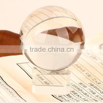 Transparent crystal ball with wooden base