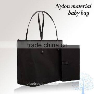 Baby bag comes with changing pad, coin purse and stroller straps