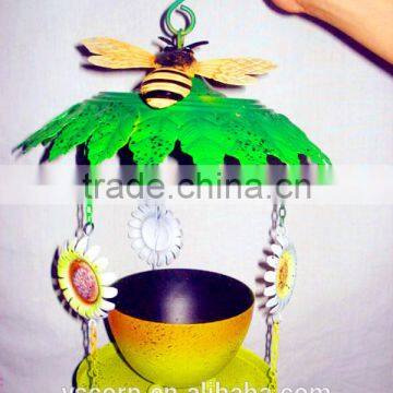 Colourful green handicraft bird feeder for garden