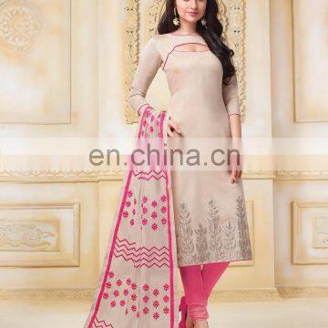 beige colored banarasi chanderi suit.