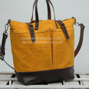 yellow waxed canvas bag with leather handles