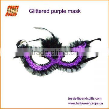 Glittered mask with feather for Carnival Party