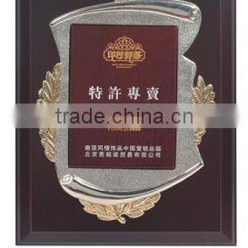 wooden award with plastic frame