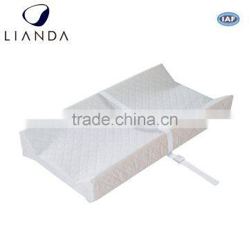 Cover removable and machine washable compressed diaper, changing pad, cutting pad