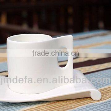 White porcelain ceramic coffee mug with saucer