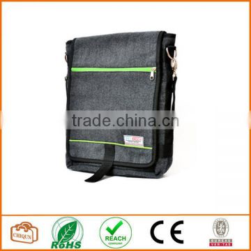 Unisex messenger bag and backpack. Grey Wool-Polyester mix with green details and lining. Multiple pockets