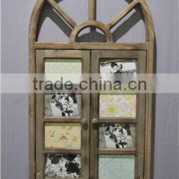 Decorative wooden panelled window with metal scrolls, distressed finish.