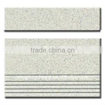 unpolished salt and pepper stair tile flooring