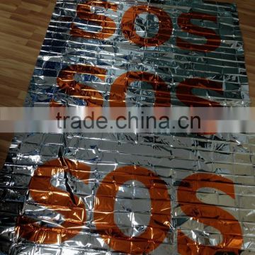 Printed thermal emergency foil blanket