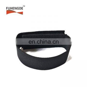 black elastic strap with white logo