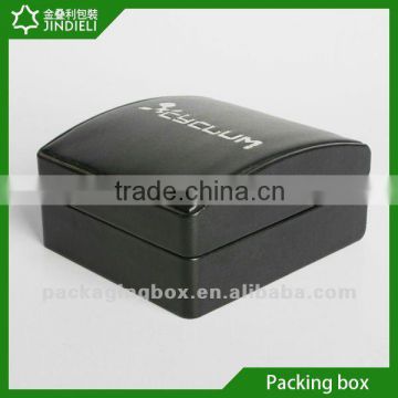 Black wood ring box with white logo