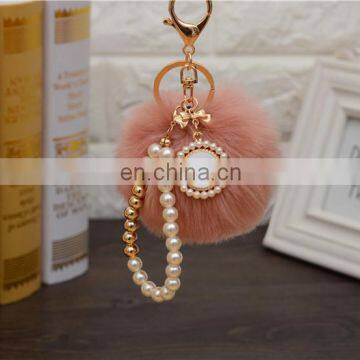 2021 Год Оптовая продажа индивидуально изготовленных роскошных ключей с шерстяными шариками, перловыми ключницами, ключницами с пупырышками и ленточными бантиками для женских сумок. Высокое качество. photo-6